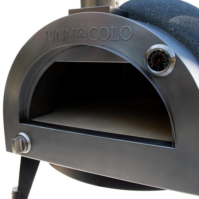 Close-up of the Fire One Up PINNACOLO L’ARGILLA Gas Fired Outdoor Clay Pizza Oven PPO-8-08, featuring a round opening, built-in thermometer, sturdy legs, and accessories—perfect for backyard cooking.
