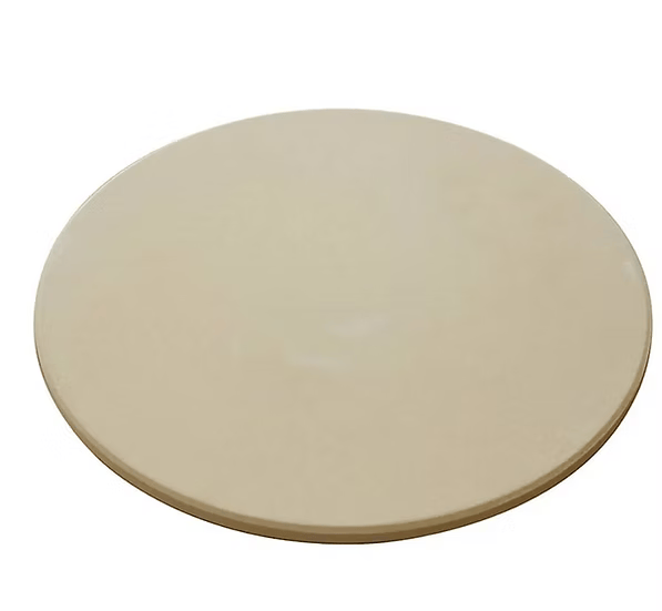 The Kokomo Grills 14-Inch Pizza Stone Kamado Ceramic Oven Insert is a round, beige ceramic pizza stone with a smooth surface, ideal as an outdoor pizza oven accessory, shown against a white background.