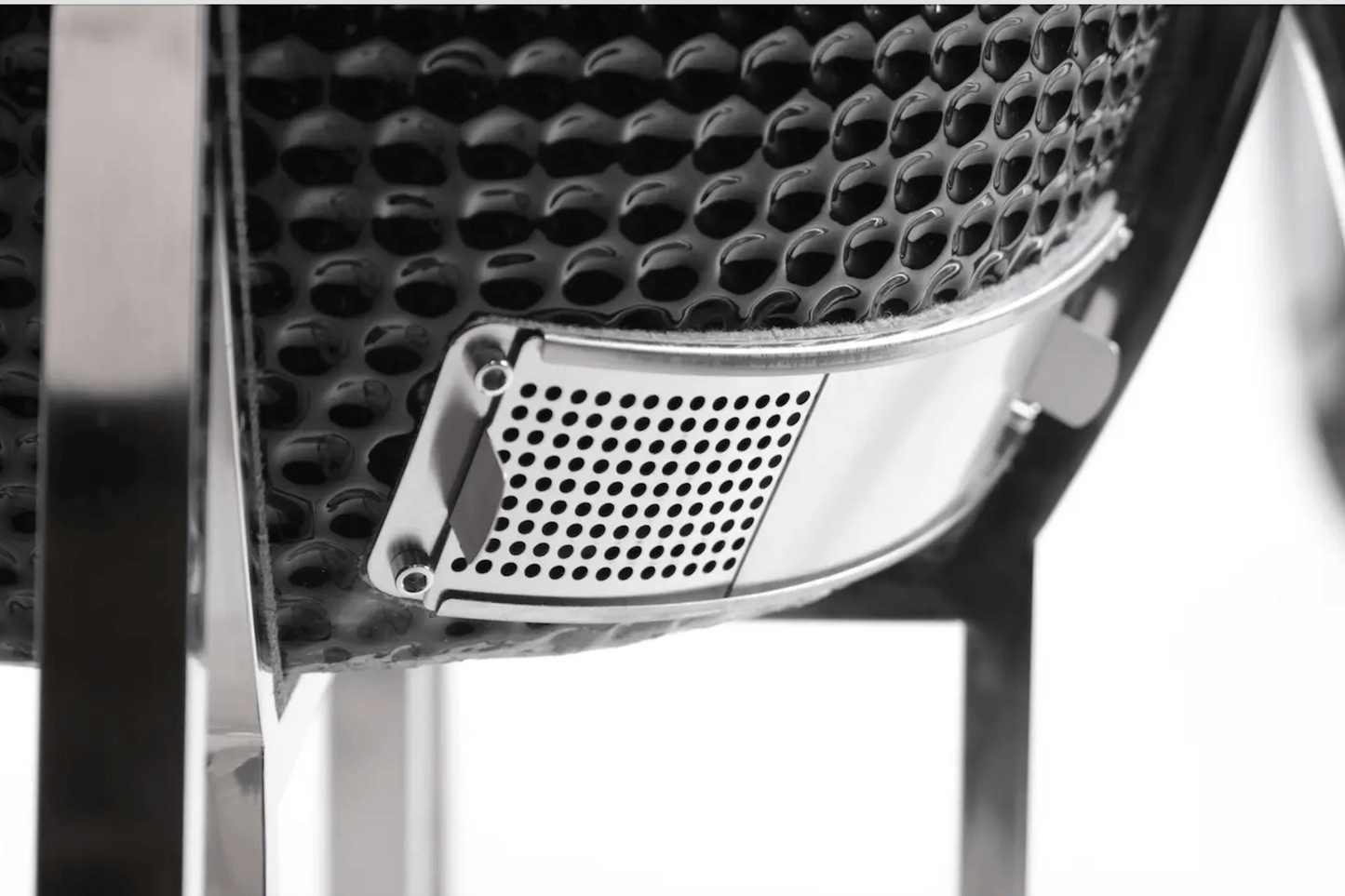 Close-up of the Kokomo Grills 21-Inch Kamado Ceramic BBQ Grill KO-21-KAMADO, featuring a black textured finish and metal vent on sturdy legs—ideal for charcoal grilling.