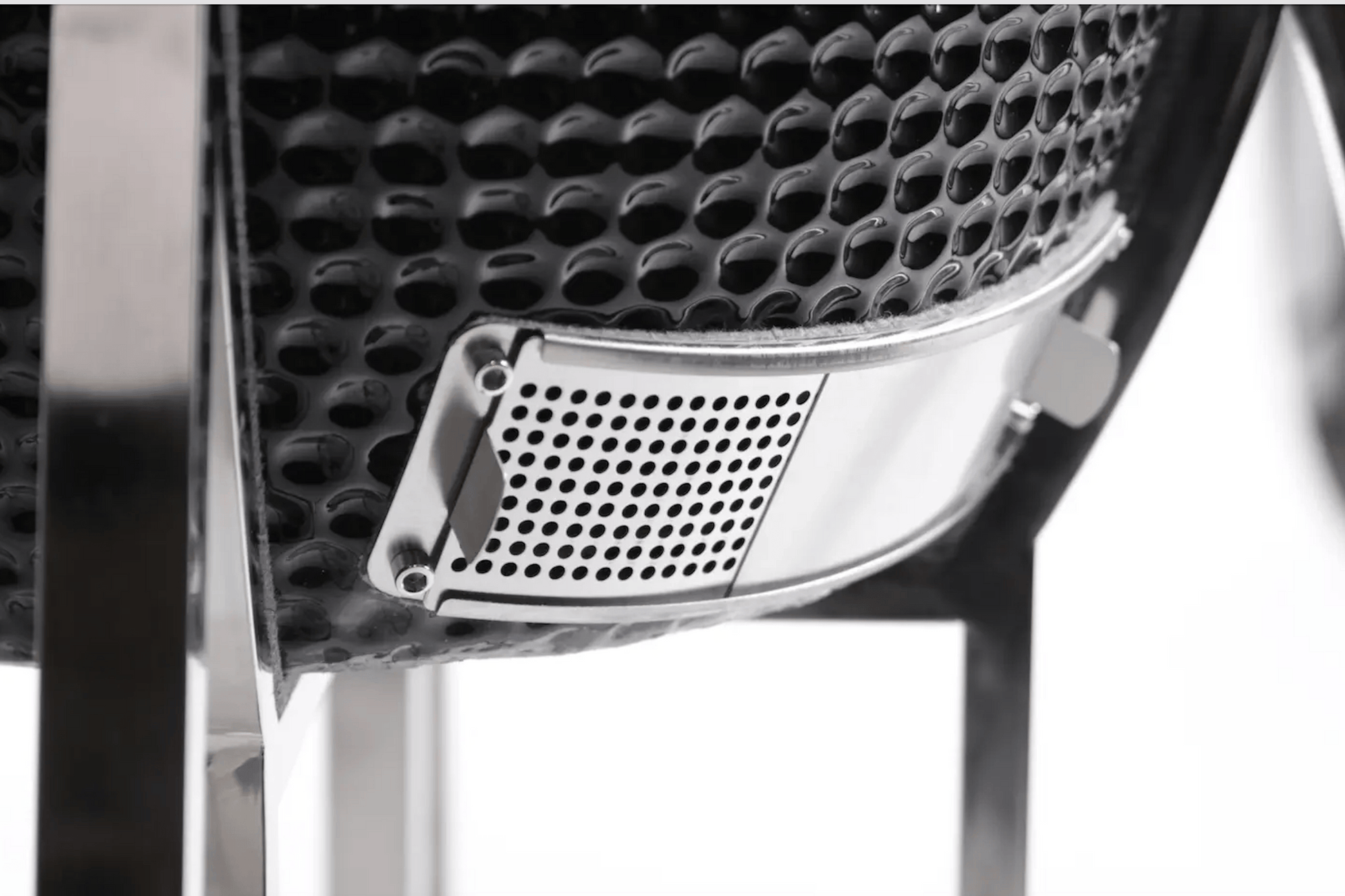 Close-up of the Kokomo Grills 21-Inch Kamado Ceramic BBQ Grill KO-21-KAMADO, featuring a black textured finish and metal vent on sturdy legs—ideal for charcoal grilling.