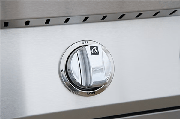 A close-up of a control knob on the Kokomo Grills 26-Inch Built-In Gas Grill (3 Burner) shows off, low, and hi settings with a flame icon indicating it controls the stainless steel grill burner in an outdoor kitchen.
