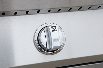 A close-up of a control knob on the Kokomo Grills 26-Inch Built-In Gas Grill (3 Burner) shows off, low, and hi settings with a flame icon indicating it controls the stainless steel grill burner in an outdoor kitchen.