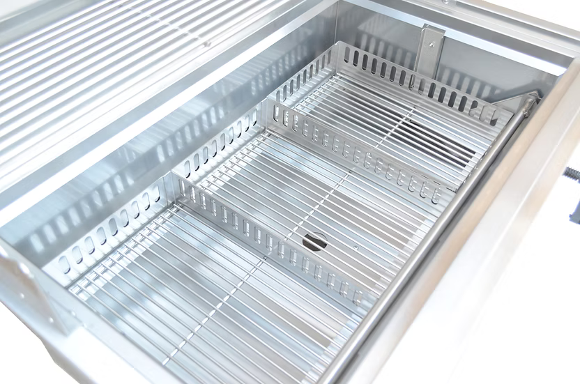 A close-up of the Kokomo Grills 32-Inch Built-In Charcoal Grill shows its 304 stainless steel build, clean metal racks, center partition, and shiny interior—ideal for any outdoor kitchen setup.