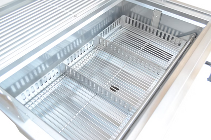A close-up of the Kokomo Grills 32-Inch Built-In Charcoal Grill shows its 304 stainless steel build, clean metal racks, center partition, and shiny interior—ideal for any outdoor kitchen setup.