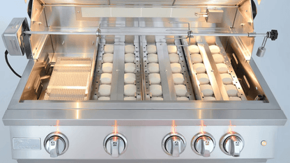 The Kokomo Grills 32-Inch Professional Built-In Gas Grill (4 Burner) features four lit control knobs, an open lid, motorized rotisserie, ceramic briquettes, and removed cooking grates—ideal for any outdoor kitchen.