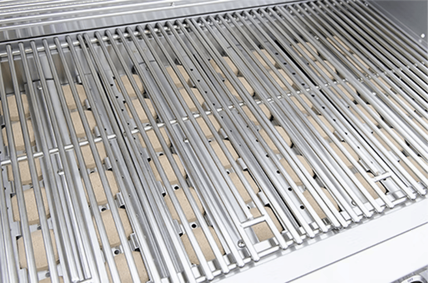 Close-up of the Kokomo Grills 3 Burner 26-Inch Cart Model BBQ Grill grate with ceramic briquettes, clean and ready for your next backyard barbecue. Features locking casters—perfect for any outdoor kitchen grill setup.