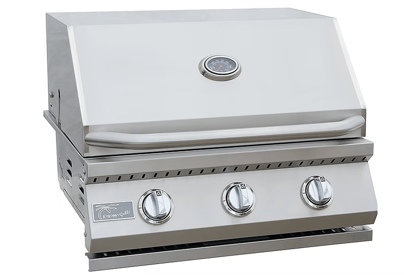 The Kokomo Grills 3 Burner 26-Inch Cart Model BBQ Grill features stainless steel, three control knobs, a built-in lid thermometer, sturdy handle, and locking casters—ideal for any outdoor kitchen. This Kokomo Grills unit appears clean and unused.