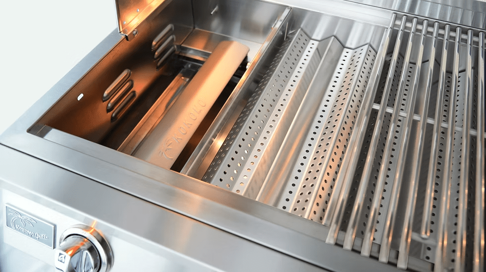 Close-up of the Kokomo Grills 40-Inch Professional Built-In Gas Grill (5 Burner), featuring grilling grates, a control knob, and a perforated heat diffuser—showcasing premium interior components for your outdoor kitchen.