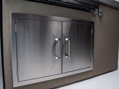 The Kokomo Grills 7-Foot Straight Kitchen Island features a stainless steel double-door cabinet with sleek handles, set in a textured beige wall—ideal for outdoor entertaining and pairs perfectly with other Kokomo Grills products.