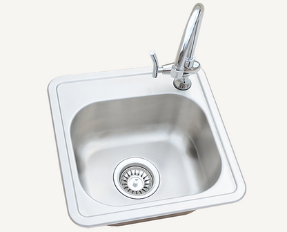 A top-down view of the Kokomo Grills Built-In 15 x 15 Outdoor Kitchen Sink KO-SINK features a clean, stainless steel basin with a modern faucet and drain stopper. The plain background highlights the sleek design, ideal for any outdoor kitchen setup.