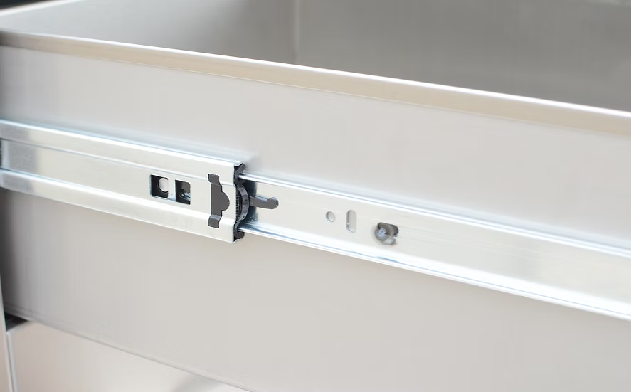 Close-up view of the Kokomo Grills Outdoor Kitchen Stainless Steel Double Drawer KO-DD12 mechanism, highlighting the metal rail and components by Kokomo Grills for smooth drawer opening and closing.
