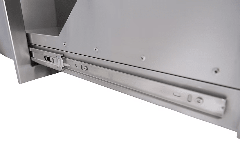 Close-up of the Kokomo Grills Outdoor Kitchen Stainless Steel Dual Trash/Propane Pull-Out KO-TRHD-2, showing its smooth metallic finish, sturdy mounting hardware, and slide rails attached to outdoor kitchen cabinetry.
