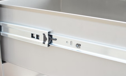 A close-up of the Kokomo Grills Outdoor Kitchen Stainless Steel Single Drawer KO-SD6 slide mechanism, highlighting the sliding rail and locking details attached to an outdoor kitchen drawer.