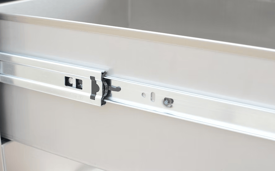Close-up of a metal drawer slide on the Kokomo Grills Outdoor Kitchen Stainless Steel Two Drawer - One Door Combo KO-ALPDC, highlighting the sliding rail—perfect for outdoor kitchen setups by Kokomo Grills.