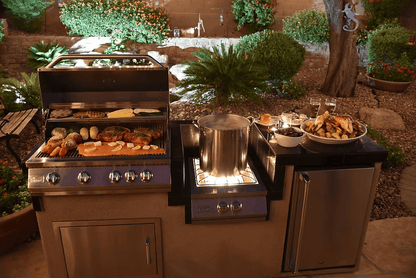 The Kokomo Grills Power Burner 4 Burner 32-Inch Built-In Barbeque Grill Island Kitchen Package by Kokomo Grills lets you grill vegetables and meat, boil in a large pot on the side burner, and serve food outdoors among lush greenery and blooming garden flowers.