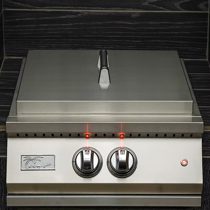 The Kokomo Grills Professional Built-In Power Burner features LED control knobs, a removable wok grate, and a stainless steel design—ideal for any outdoor kitchen. Shown with a closed lid against dark wood panels.