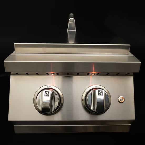 The KoKoMo Grills Professional Double Side Burner with Removable Cover features two off-position knobs with orange indicator lights, all in sleek stainless steel—an ideal addition to your outdoor kitchen by Kokomo Grills.