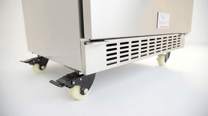 Close-up of the Kokomo Grills Professional Luxury Outdoor Kitchen Kegerator KO-LUX-KEG, crafted from 304 stainless steel with four caster wheels, ventilation slots, and a brake lever, set against a white background.