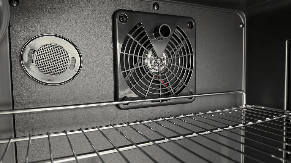 Close-up of the Kokomo Grills Professional Luxury Outdoor Kitchen Kegerator KO-LUX-KEG interior, featuring a wire rack, circular vent, and black cooling fan—ideal for any premium outdoor kitchen setup.