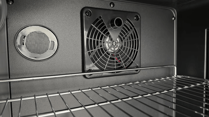 Close-up of the Kokomo Grills Professional Luxury Outdoor Kitchen Kegerator KO-LUX-KEG interior, featuring a wire rack, circular vent, and black cooling fan—ideal for any premium outdoor kitchen setup.