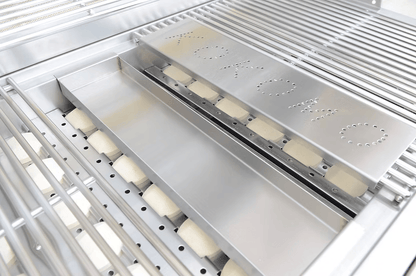 Close-up of a stainless steel grill with "Kokomo Grills" perforated on the cover, featuring grates, burner parts, and a Kokomo Grills Smoker Chip Box Insert KO-BAK-SMKBX—an essential BBQ accessory for smoky flavor.