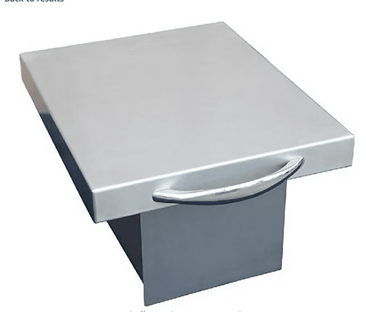 The Kokomo Grills Trash Chute and Cutting Board KO-TRSCH features a rectangular stainless steel surface with a shiny handle, resembling a commercial kitchen lid, and a sturdy base for outdoor use.