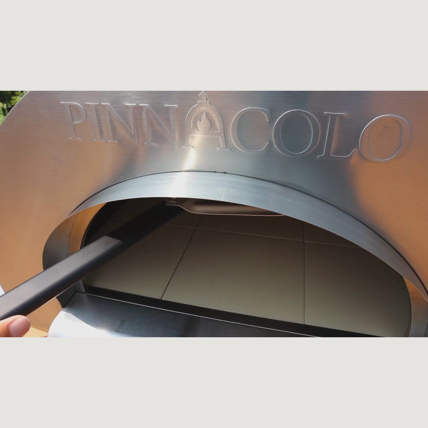 The PINNACOLO PREMIO Wood-Fired Outdoor Pizza Oven can satisfy everything from small pizza cravings to large parties. Scenes depict a variety of dishes, from pizza to breads and desserts, with an emphasis on its high heat retention quality.