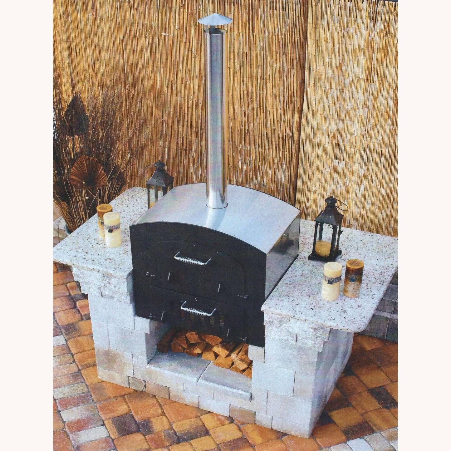 Tuscan Chef Medium Built-In Deluxe Family Pizza Oven (Model GX-CM) – Partially installed in a custom white countertop, with salt and pepper shakers and light fixtures on both sides.