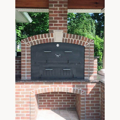 Tuscan Chef Large Built-In Pizza Oven (Model GX-DL) – Installed in brick enclosure within an outdoor kitchen setting.